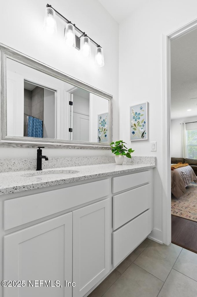 638 Windley Dr, Saint Augustine, FL 32092 - bathroom with vanity, tile patterned flooring, and connected bathroom