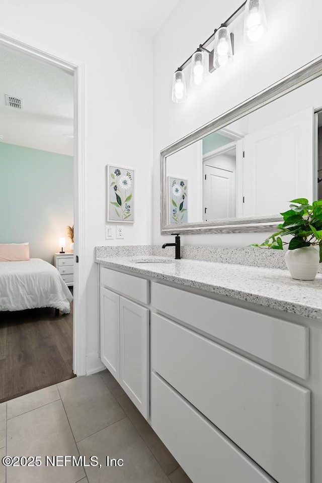 638 Windley Dr, Saint Augustine, FL 32092 - ensuite bathroom featuring vanity and tile patterned floors