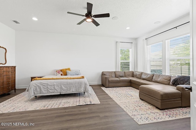 638 Windley Dr, Saint Augustine, FL 32092 - bedroom with recessed lighting, baseboards, dark wood-type flooring, ceiling fan, and a textured ceiling