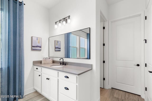 638 Windley Dr, Saint Augustine, FL 32092 - bathroom featuring vanity, wood finished floors, and baseboards