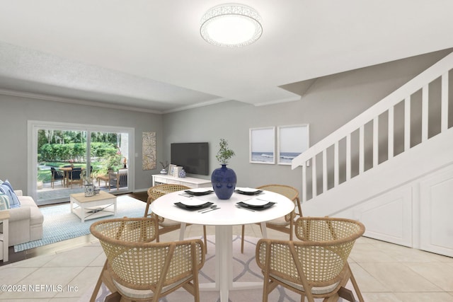 3036 Sea Marsh Rd, Fernandina Beach, FL 32034 - dining space with light tile patterned floors, ornamental molding, and stairs
