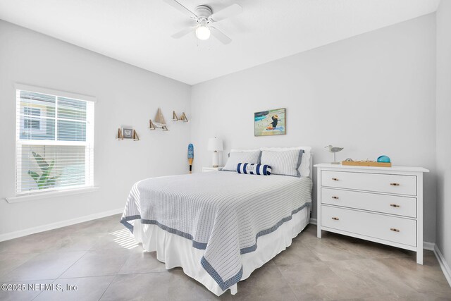 25 Carnauba Way, Jacksonville, FL 32081 - bedroom with baseboards, a ceiling fan, and light tile patterned floors