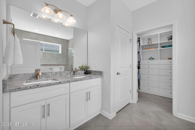 25 Carnauba Way, Jacksonville, FL 32081 - full bath with double vanity, a walk in closet, a tile shower, tile patterned floors, and baseboards