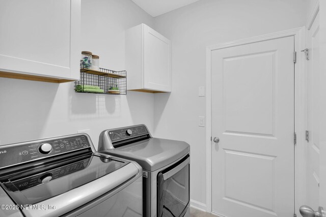 25 Carnauba Way, Jacksonville, FL 32081 - washroom featuring cabinet space and separate washer and dryer