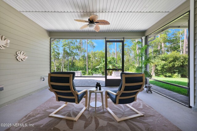 25 Carnauba Way, Jacksonville, FL 32081 - sunroom / solarium with an outdoor living space, a ceiling fan, wooden walls, and view of scattered trees