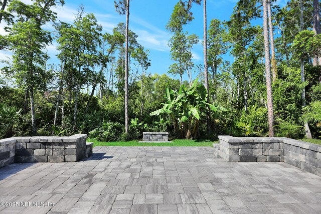 25 Carnauba Way, Jacksonville, FL 32081 - view of patio / terrace with view of wooded area