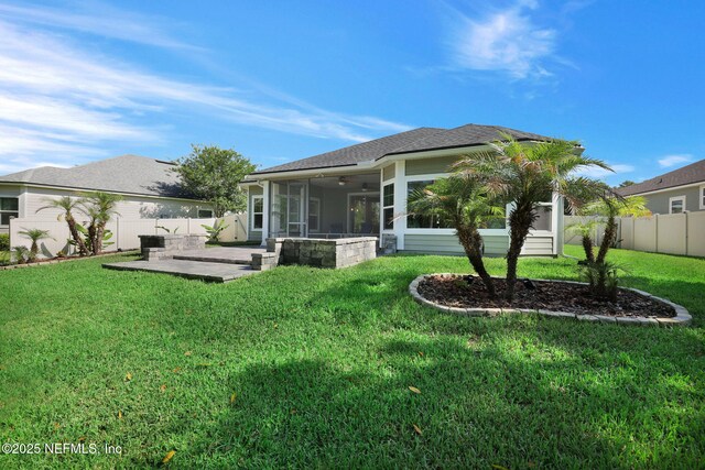 25 Carnauba Way, Jacksonville, FL 32081 - rear view of house featuring a sunroom, a patio area, a ceiling fan, and roof with shingles