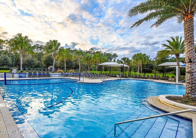 25 Carnauba Way, Jacksonville, FL 32081 - community pool featuring view of wooded area and a patio