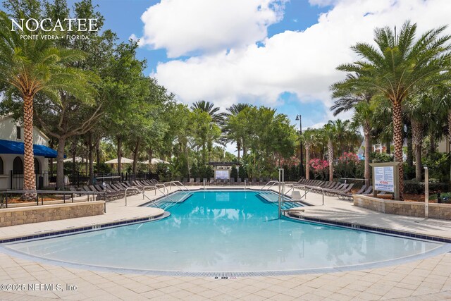 25 Carnauba Way, Jacksonville, FL 32081 - community pool featuring a patio area