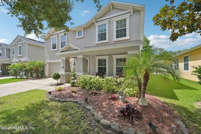 145 Thornloe Dr, Saint Johns, FL 32259 - traditional home with stucco siding, a garage, driveway, a front lawn, and covered porch