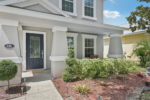 145 Thornloe Dr, Saint Johns, FL 32259 - property entrance featuring stucco siding and a porch