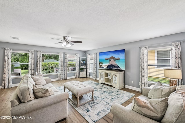 145 Thornloe Dr, Saint Johns, FL 32259 - living area with baseboards, a textured ceiling, wood finished floors, and ceiling fan