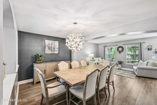 145 Thornloe Dr, Saint Johns, FL 32259 - dining space with wood finished floors, a textured ceiling, baseboards, and a chandelier