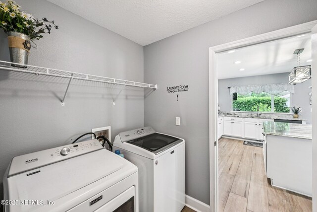 145 Thornloe Dr, Saint Johns, FL 32259 - washroom featuring independent washer and dryer, light wood-style floors, and recessed lighting