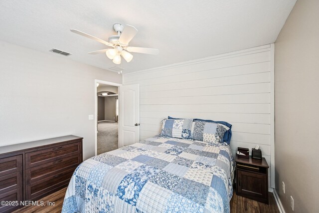 145 Thornloe Dr, Saint Johns, FL 32259 - bedroom with dark wood-style floors, a ceiling fan, and baseboards