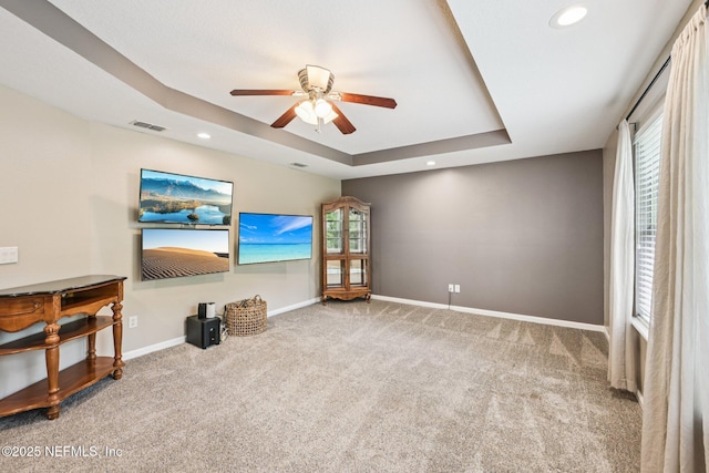145 Thornloe Dr, Saint Johns, FL 32259 - unfurnished living room featuring a ceiling fan, carpet, a tray ceiling, recessed lighting, and baseboards