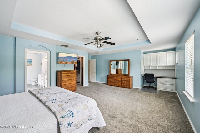 145 Thornloe Dr, Saint Johns, FL 32259 - bedroom featuring a raised ceiling, a walk in closet, carpet floors, and baseboards