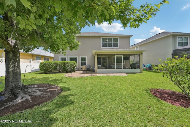 145 Thornloe Dr, Saint Johns, FL 32259 - back of property featuring a sunroom, a patio, and stucco siding
