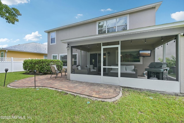 145 Thornloe Dr, Saint Johns, FL 32259 - back of property featuring a sunroom, stucco siding, and a patio