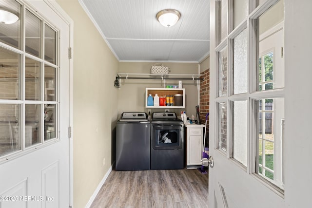 147 Quarton Dr, Orange Park, FL 32073 - washroom featuring washing machine and clothes dryer, wood finished floors, healthy amount of natural light, crown molding, and baseboards