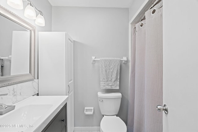 147 Quarton Dr, Orange Park, FL 32073 - full bathroom with vanity, toilet, baseboards, and curtained shower