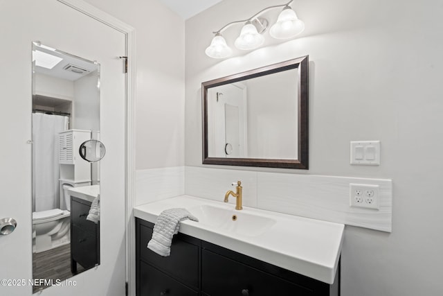 147 Quarton Dr, Orange Park, FL 32073 - bathroom with vanity, toilet, and backsplash