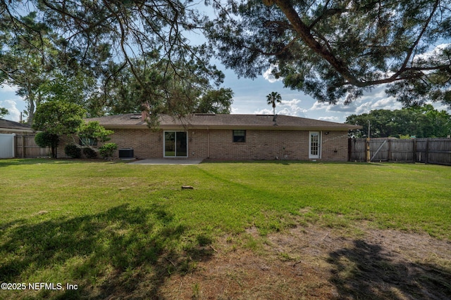 147 Quarton Dr, Orange Park, FL 32073 - back of house featuring brick siding, a patio area, and central AC