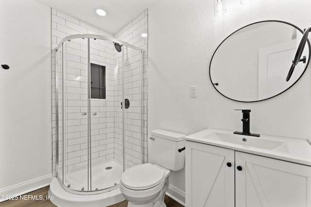 9007 7th Ave, Jacksonville, FL 32208 - full bath with vanity, toilet, a shower stall, and wood finished floors