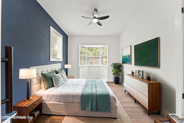 9007 7th Ave, Jacksonville, FL 32208 - bedroom featuring light wood-style flooring, ceiling fan, and baseboards