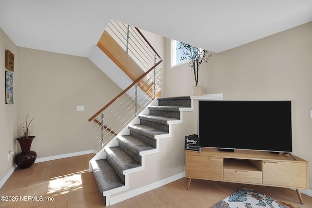 2898 Ocean Shore Blvd Unit 4020, Ormond Beach, FL 32176 - stairs featuring wood finished floors and baseboards