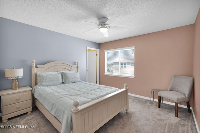 2898 Ocean Shore Blvd Unit 4020, Ormond Beach, FL 32176 - bedroom with carpet flooring, a textured ceiling, baseboards, and ceiling fan