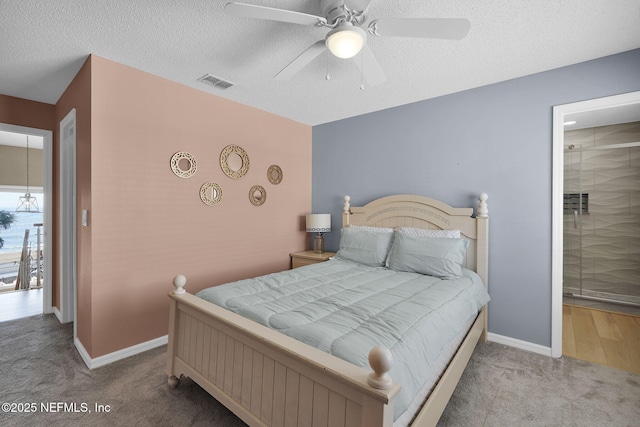 2898 Ocean Shore Blvd Unit 4020, Ormond Beach, FL 32176 - carpeted bedroom featuring baseboards, a textured ceiling, and ceiling fan