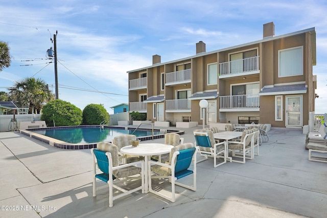 2898 Ocean Shore Blvd Unit 4020, Ormond Beach, FL 32176 - community pool featuring a patio and outdoor dining space