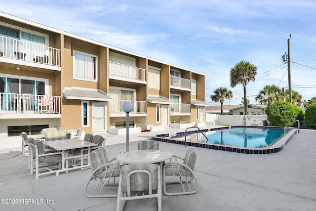 2898 Ocean Shore Blvd Unit 4020, Ormond Beach, FL 32176 - community pool with a patio area and outdoor dining area