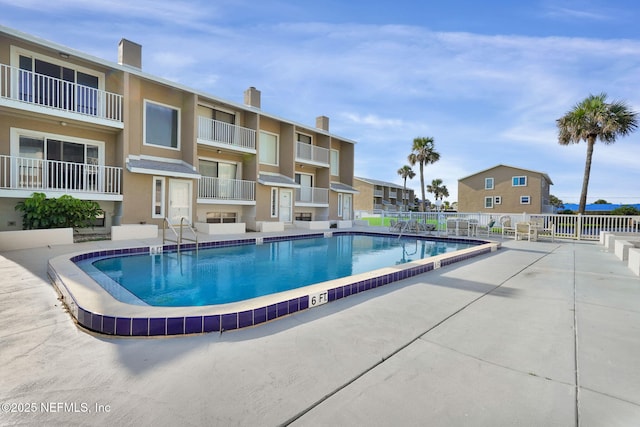 2898 Ocean Shore Blvd Unit 4020, Ormond Beach, FL 32176 - community pool with a residential view and a patio
