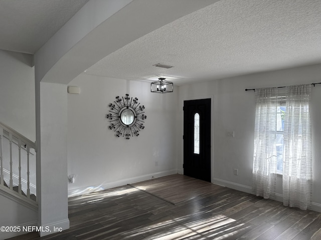 305 Carriage Hill Ct, Saint Johns, FL 32259 - entrance foyer featuring wood finished floors, stairs, a textured ceiling, baseboards, and a chandelier