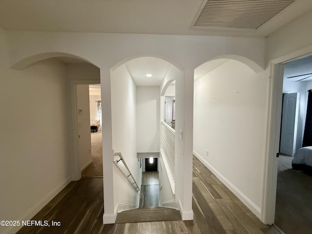 305 Carriage Hill Ct, Saint Johns, FL 32259 - corridor featuring wood finished floors, baseboards, an upstairs landing, and arched walkways