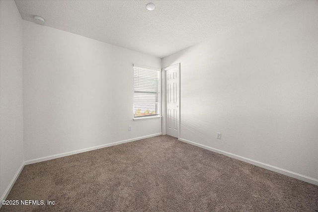 403 Boulder Ln, Jacksonville, FL 32259 - empty room featuring a smoke detector, carpet floors, baseboards, and a textured ceiling