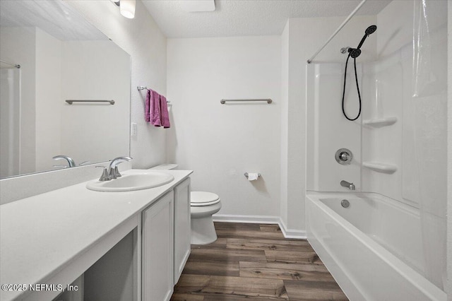 403 Boulder Ln, Jacksonville, FL 32259 - full bath featuring wood finished floors, toilet, vanity, washtub / shower combination, and a textured ceiling