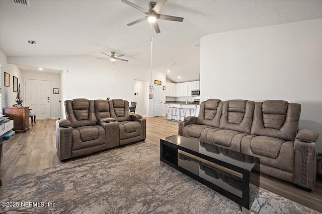 403 Boulder Ln, Jacksonville, FL 32259 - living area with a ceiling fan, vaulted ceiling, light wood finished floors, a textured ceiling, and recessed lighting