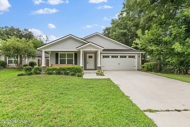 4116 Adirolf Rd, Jacksonville, FL 32207 - view of front of property featuring a garage, driveway, and a front yard