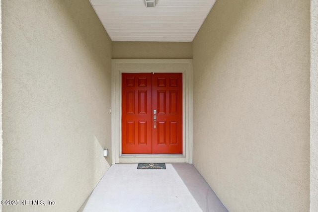 1684 Sanctuary Way, Fleming Island, FL 32003 - view of exterior entry with stucco siding