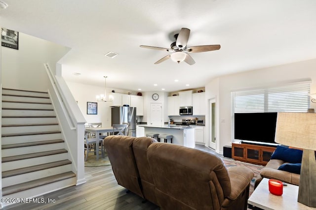 1684 Sanctuary Way, Fleming Island, FL 32003 - living area with stairs, a ceiling fan, light wood-type flooring, a chandelier, and recessed lighting