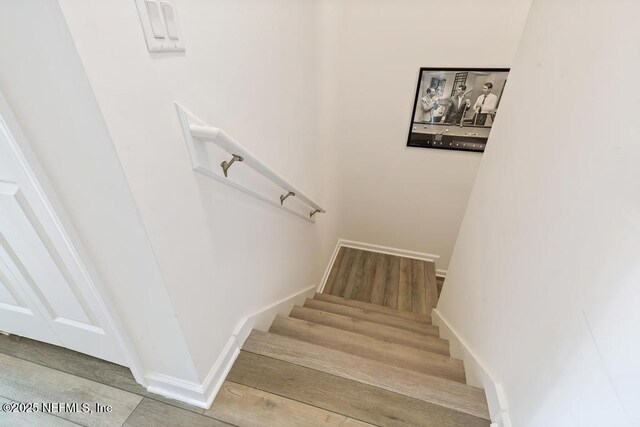 1684 Sanctuary Way, Fleming Island, FL 32003 - stairway featuring wood finished floors and baseboards