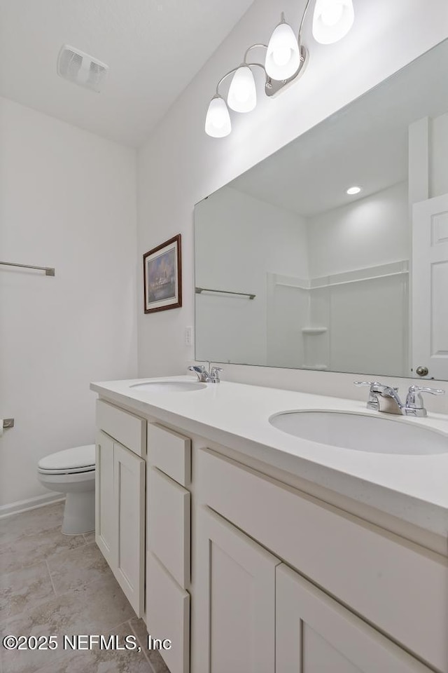 1684 Sanctuary Way, Fleming Island, FL 32003 - full bath featuring toilet, double vanity, and baseboards