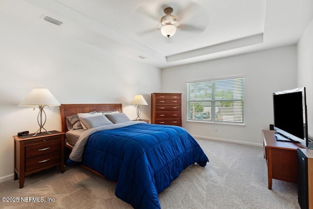 1684 Sanctuary Way, Fleming Island, FL 32003 - carpeted bedroom with baseboards, a raised ceiling, and ceiling fan