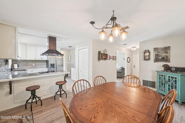 884 Live Oak Ln, Fleming Island, FL 32003 - dining room with light wood-style flooring