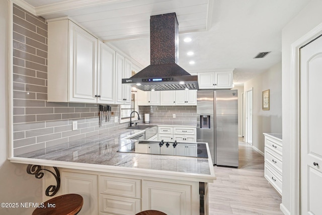 884 Live Oak Ln, Fleming Island, FL 32003 - kitchen with stainless steel fridge with ice dispenser, extractor fan, decorative backsplash, and a peninsula