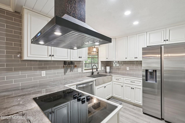 884 Live Oak Ln, Fleming Island, FL 32003 - kitchen featuring appliances with stainless steel finishes, wall chimney exhaust hood, white cabinetry, tasteful backsplash, and recessed lighting