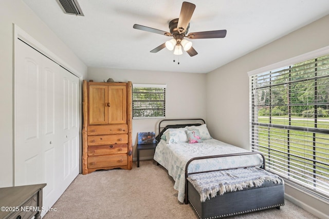 884 Live Oak Ln, Fleming Island, FL 32003 - bedroom with light colored carpet, a closet, and ceiling fan